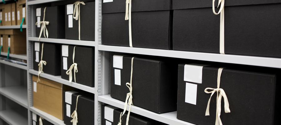 Boxes of archived files on a shelf