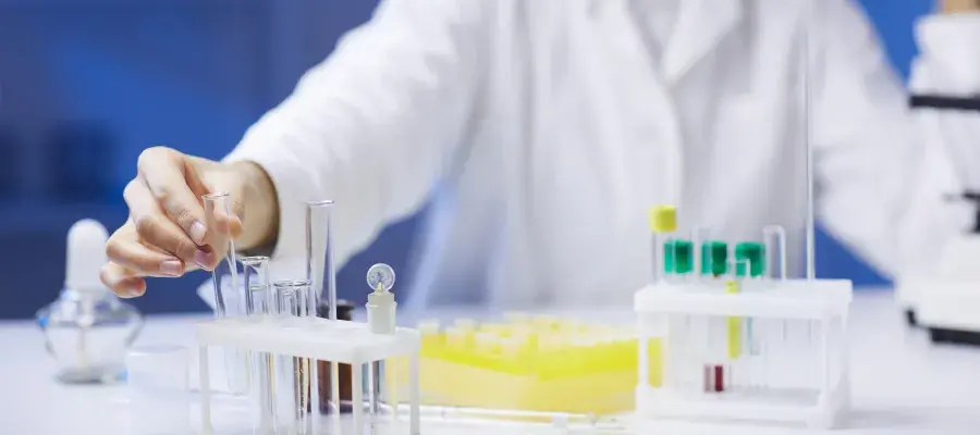 Person in white coat in a laboratory
