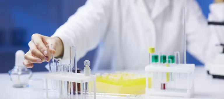 Person in white coat in a laboratory